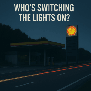 A service station on the side of the road with the lights out.